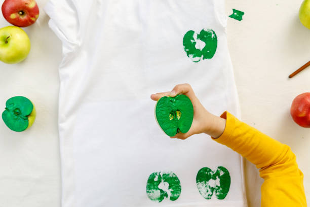 process of apple prints on clothes. step-by-step instruction Printing of stamps. handmade with an exclusive print on clothes. step-by-step instruction stampeding photos stock pictures, royalty-free photos & images