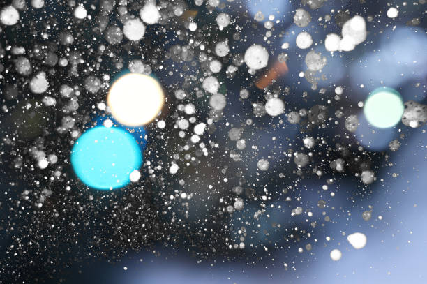 istock background of blurry christmas lights and snow 1291274293