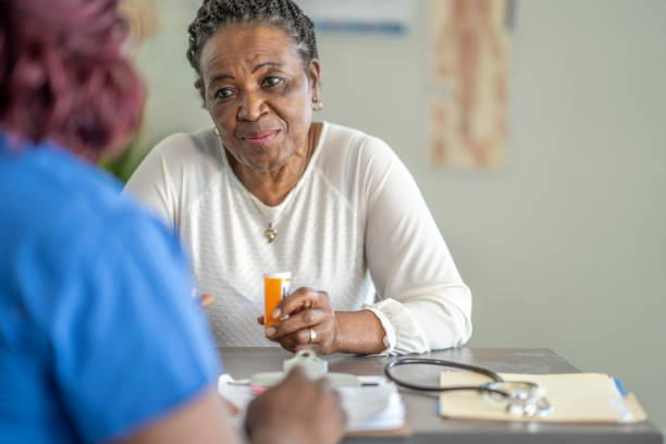 istock Senior woman visiting the doctor 1291274573