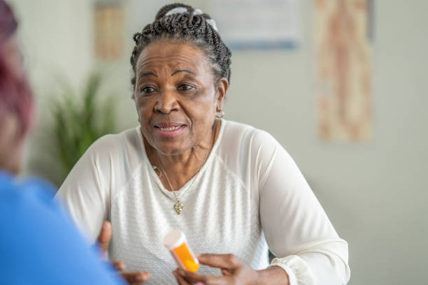 istock Senior woman visiting the doctor 1291274583