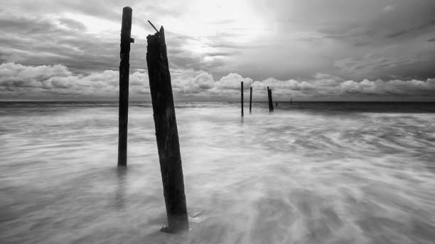 istock Decay bridge at Pilai beach, black and white 1291276633
