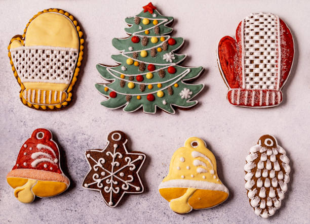 istock Christmas Gingerbread on gray background. Fir tree, Snowflake, spruce, mitten, cones, bell. 1291281245
