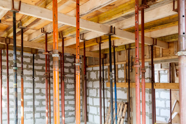 istock view of wooden formwork with metallic holders, which will be filled with overlap between floors in country house under construction from foam block 1291281611