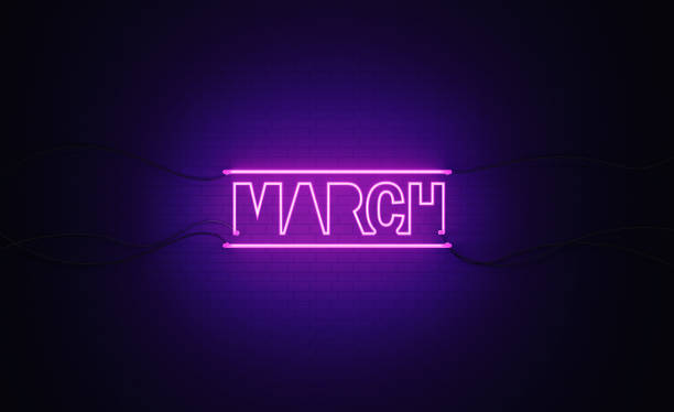 istock Purple Neon Light Writes March on Black Bricked Wall 1291282249