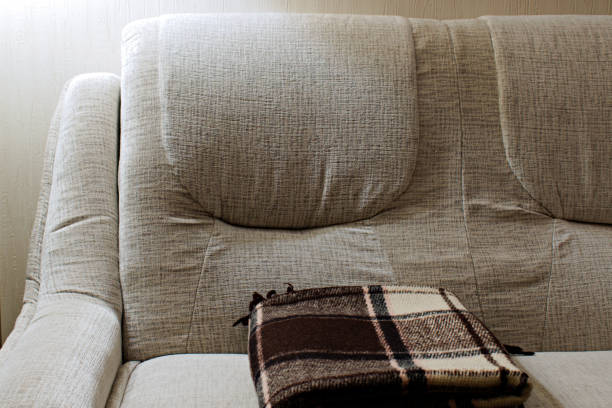 istock warm plaid on a soft sofa at home 1291284462