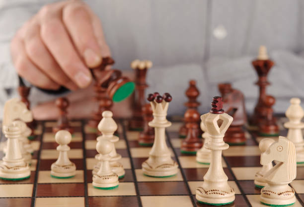 istock Chess figures on the wooden board. 1291284652