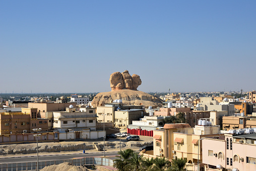 Al-Qarah, Al-Hofuf, Al-Ahsa Oasis, Eastern Province / al-Mintaqah ash-Sharqiyah, Saudi Arabia: Hill of the Heads - Ras Al-Qarah mount, surrounded by a residential quarter - buildings with terraces.