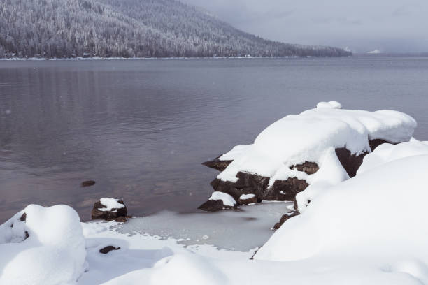 istock Large Rocks Covered in Snow at Mountain Lake in Winter 1291286694