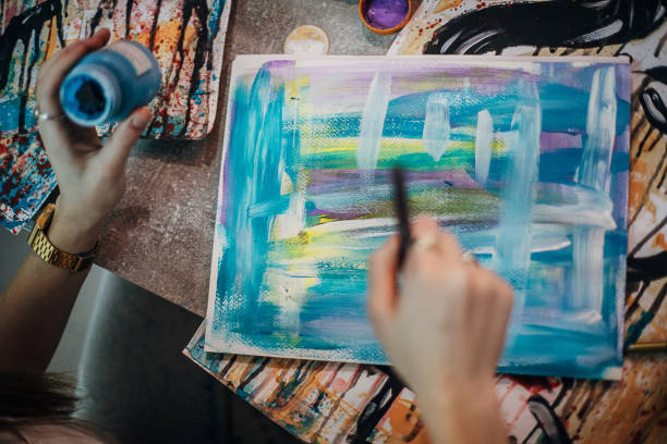 istock Close up of painter painting in her art studio 1291288895
