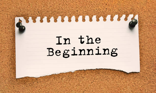 istock Paper note written with IN THE BEGINNING inscription on cork board 1291289781