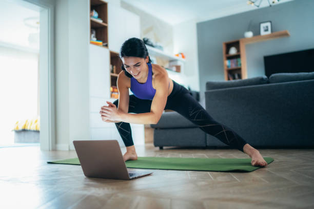 istock Woman working out at home 1291290055