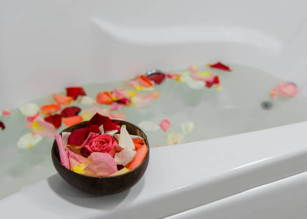 istock a relaxing candle and rose petals in a bathroom 1291290970