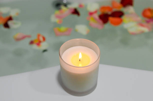 istock a relaxing candle and rose petals in a bathroom 1291290983
