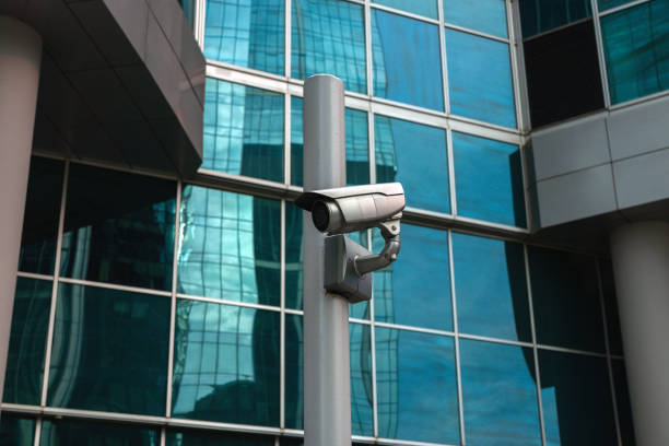 istock External surveillance camera against glass building facade 1291291223