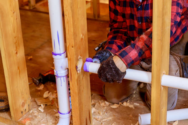 istock Plumbing contractor installing PVC plastic drain pipe in the section for custom house 1291293174
