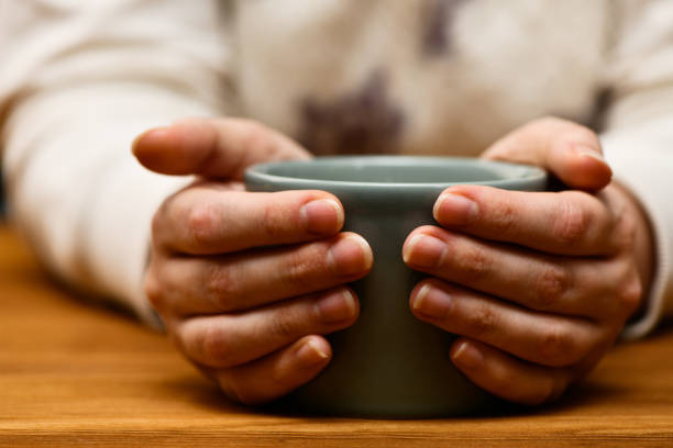 istock Woman drinks hot cocoa or coffee 1291293462