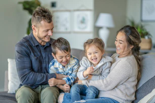 istock Multi-ethnic family enjoying quality time 1291295432