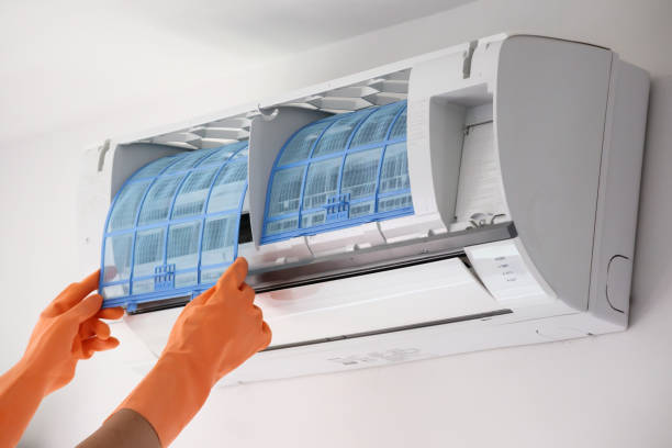 istock Asian man hand hold air conditioner filter cleaning concept 1291299861