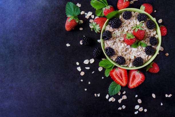 istock oatmeal with strawberry blackberries 1291303159