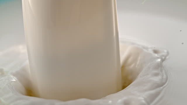 SUPER SLO MO Pouring milk into the barrel