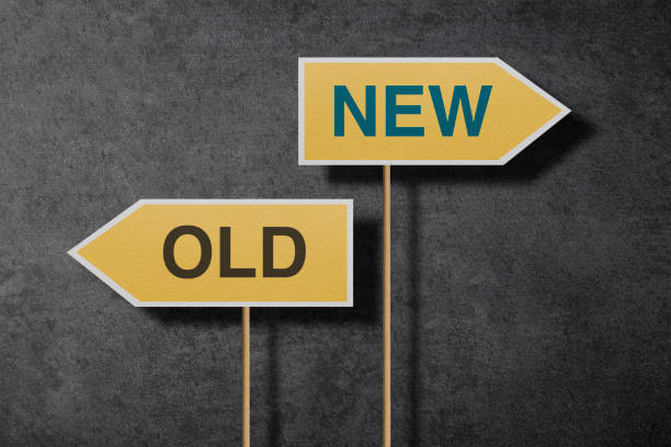 istock Old And New On Two Directional Road signs 1291305768