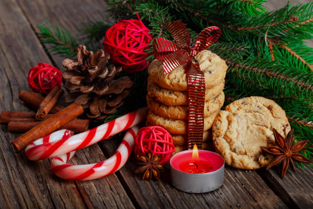 istock Christmas gingerbread cookies with candy cane and christmas tree on wooden rustic table 1291311475