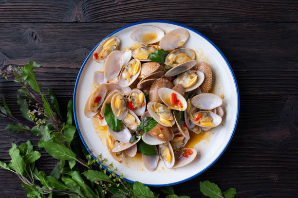 istock Stir fried Spicy Clam (Surf clam, Short necked clam, Carpet clam, Venus shell, Baby clam) with Thai Holy Basil 1291312092