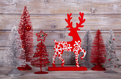 Picture of a Christmas decorative forest with deers, trees, greens and berrys
