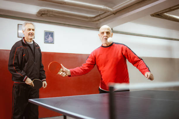istock Seniors play table tennis 1291312395