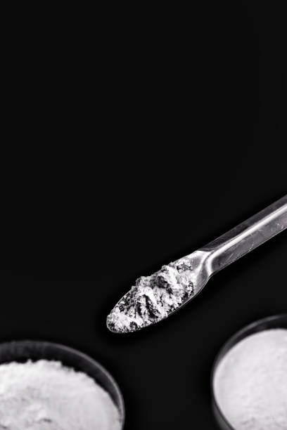 istock spatula with small portion of calcium carbonate, isolated black background 1291313040