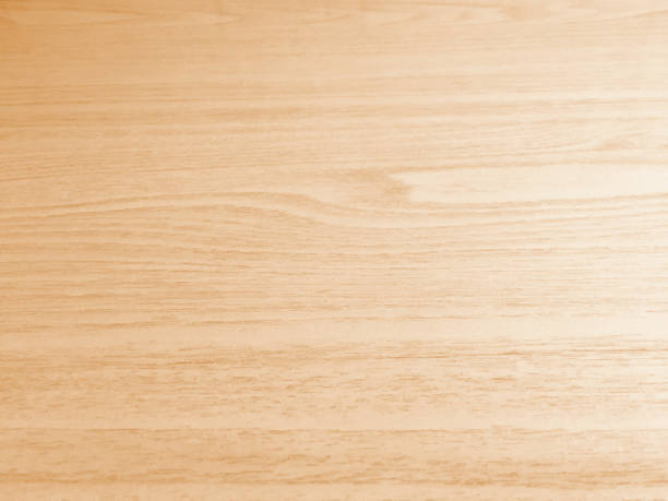 Light brown wood grain background.