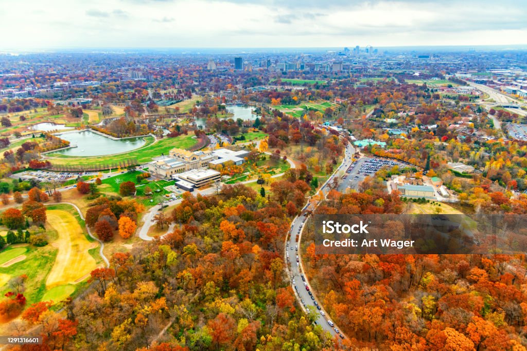 Forest Park - St. Louis Wide angle aerial view of Forest Park, known as the "Heart of St. Louis"; originally opened in the late 1800's, Forest Park is approximately 1300 acres of public parkland just west of downtown featuring numerous museums, a planetarium, the St. Louis Zoo, and a large outdoor amphitheater.  The skyline of downtown St. Louis is visible in the distance. St. Louis - Missouri Stock Photo