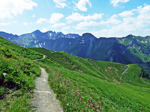 Walking and hiking trails over the Malbuntal alpine valley and in the Liechtenstein Alps mountain range - Malbun, Liechtenstein stock photo