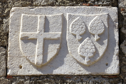 Coat of arms on the wall of a medieval house, the Old Town of Rhodes, Rhodes, Greece. The Old Town of Rhodes is one of the attractions of the city of Rhodes