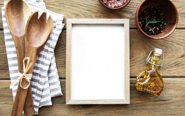 istock Old wooden kitchen utensils and spices with frame as a border 1291327219