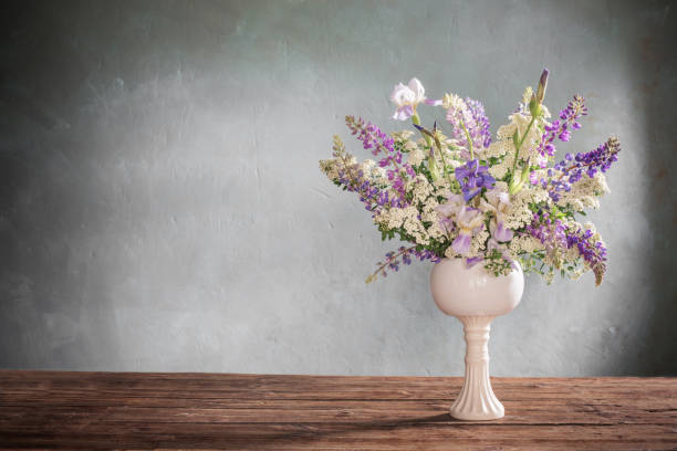istock summer bouquet in white vase  on gray background 1291328896