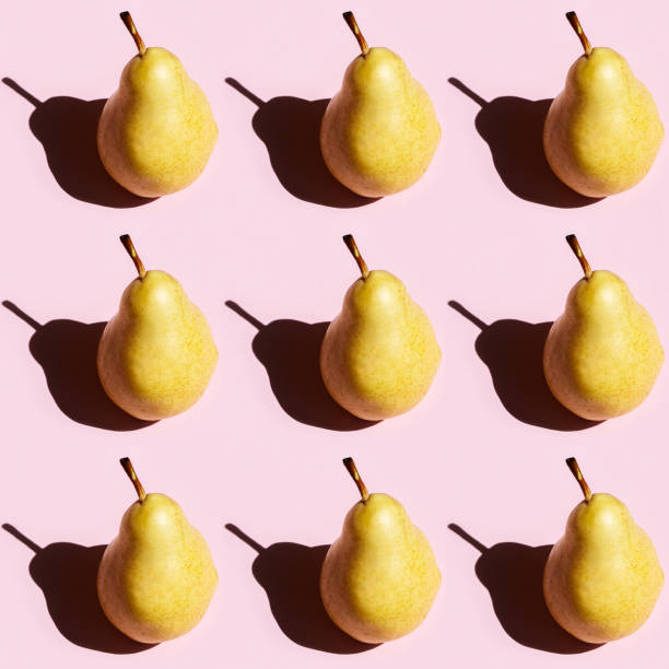 istock Seamless regular creative pattern of fruit pear with dark shadows. Printing on fabric, wrapping paper. 1291330900