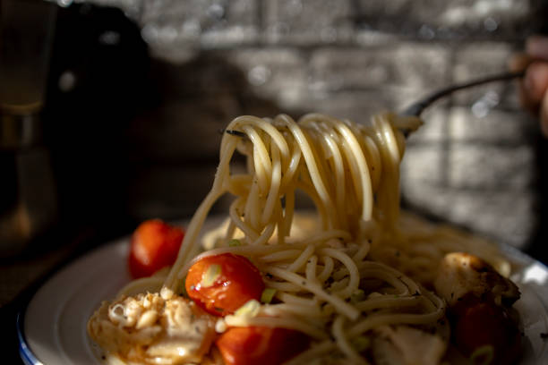 istock home cooked spaghetti, with sole fish fillet and cherry tomato 1291331135