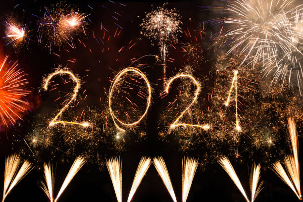 istock 2021 new year made with sparklers on black background 1291334451