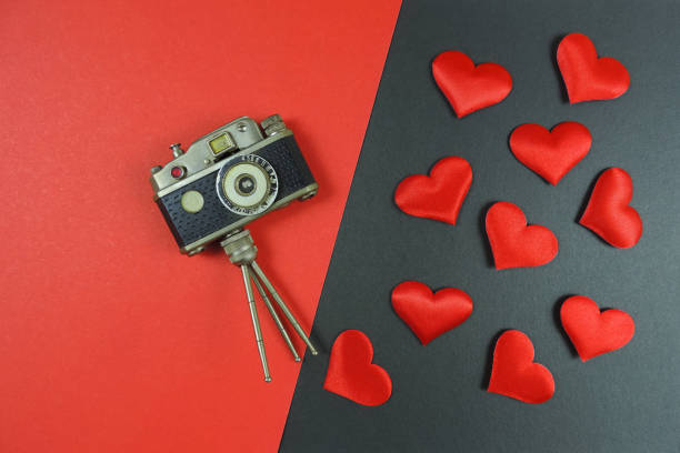 istock flat lay  vintage retro camera and red hearts  , valentine day concept 1291334545