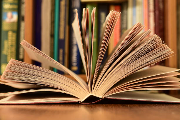 istock The open book lies on the table 1291334546