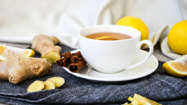 istock Ginger hot immunity boosting Vitamin natural drink With citrus lemon cinnamon anise in a rustic style on wooden background. Chamomile tea 1291337378