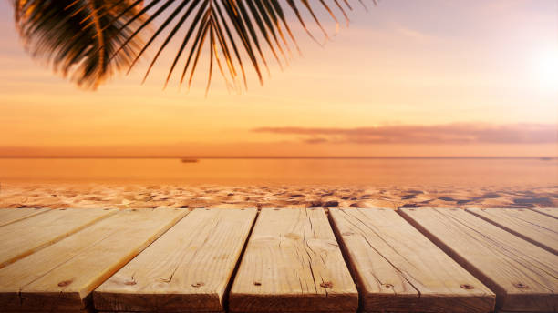 istock Wooden platform on the sunset beach 1291339447