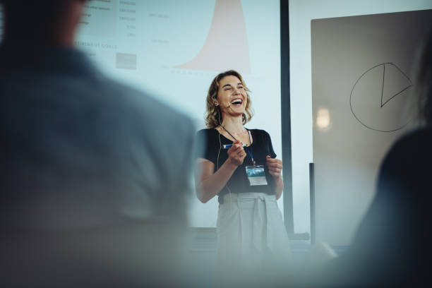 istock Businesswoman smiling during presentation speech 1291339687