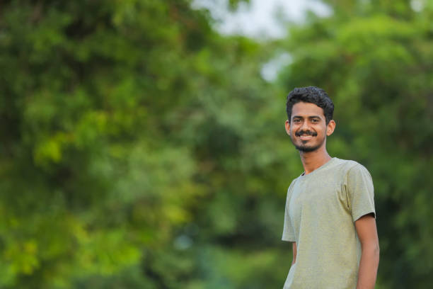 istock Young indian man showing expression over nature background 1291342298