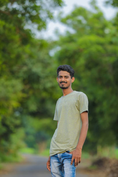 istock Young indian man showing expression over nature background 1291342330