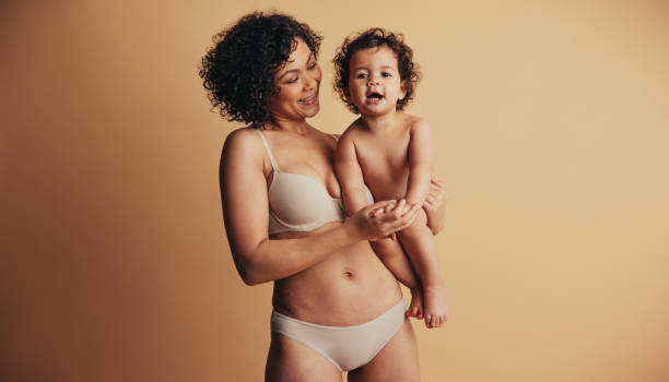 istock Happy mother with her baby 1291342580