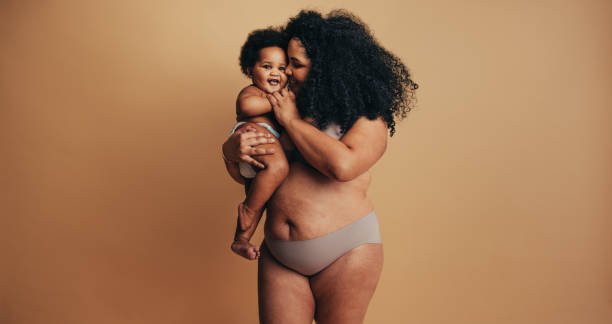 istock Plus size woman with her baby 1291343216