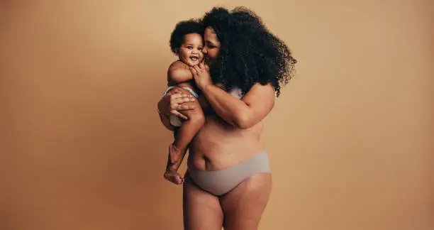 Photo of Plus size woman with her baby