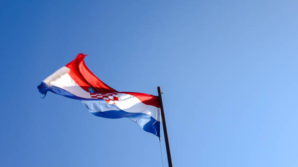 istock Croatian Flag show from a low angle 1291345083